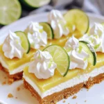 Für diese No Bake Key Lime Pie Cheesecake Bars brauchst du: - 1 ½ Tassen Graham Cracker Brösel - ⅓ Tasse Kristallzucker - ½ Tasse ungesalzene Butter, geschmolzen - 16 oz Frischkäse, weich - 1 Tasse Puderzucker - ½ Tasse saure Sahne - 1 Esslöffel Limettenschale - ½ Tasse frischer Limettensaft (ca. 4-5 Limetten) - 1 Teelöffel Vanilleextrakt - 1 Tasse Schlagsahne Diese Zutaten sind wichtig für den frischen, cremigen Geschmack. Die Mischung aus Limette und Frischkäse bringt den perfekten Genuss. Achte darauf, dass der Frischkäse wirklich weich ist. So wird die Füllung schön cremig. Verwende frische Limetten für den besten Geschmack. Der frische Limettensaft ist der Schlüssel zu diesem Rezept. Die Schlagsahne sollte kalt sein, damit sie beim Schlagen gut aufgeht. Wenn du die richtige Konsistenz erhältst, wird die Füllung luftig und leicht. Falls du keine Graham Cracker hast, kannst du Kekse wie Digestive oder Butterkekse verwenden. Diese geben auch einen tollen Geschmack. Für eine leichtere Variante kannst du griechischen Joghurt anstelle von saurer Sahne nutzen. Das gibt eine schöne Frische. Wenn du eine vegane Option suchst, gibt es pflanzliche Frischkäse-Marken. Diese sind meist cremig genug für die Füllung. Mit diesen Zutaten und Tipps machst du dir leckere Cheesecake Bars, die jeder liebt! Um den Boden für die Cheesecake-Riegel zu machen, mische zuerst die Graham Cracker Brösel, den Kristallzucker und die geschmolzene Butter in einer großen Schüssel. Du willst eine sandige Textur bekommen. Nach dem Mischen drücke die Mischung gleichmäßig in eine 9x9-Zoll Backform. Nutze den Boden eines Messbechers, um alles festzudrücken. Stelle die Form für eine Weile in den Kühlschrank. So wird der Boden stabil und bereit für die Füllung. Jetzt ist es Zeit für die Füllung! Nimm die große Schüssel und schlage den weichen Frischkäse mit einem Handrührgerät cremig. Füge nach und nach den Puderzucker, die saure Sahne, die Limettenschale, den Limettensaft und den Vanilleextrakt hinzu. Mische alles gut, bis es eine glatte und cremige Konsistenz hat. In einer separaten Schüssel schlage die Schlagsahne, bis sich steife Spitzen bilden. Diese Sahne wird deiner Füllung eine tolle Luftigkeit geben. Hebe die geschlagene Sahne vorsichtig unter die Frischkäse-Mischung. So bleibt die Füllung leicht und fluffig. Gieße die fertige Cheesecake-Füllung gleichmäßig über den gekühlten Graham Cracker Boden. Streiche die Oberfläche glatt. Decke die Form mit Frischhaltefolie ab und stelle sie für mindestens 4 Stunden in den Kühlschrank. Das Kühlen macht die Riegel fest und bereit zum Servieren. Nach dem Kühlen schneide die Riegel in Stücke. Du kannst sie mit zusätzlicher Limettenschale oder einem Klecks Schlagsahne garnieren, um sie noch schöner zu machen. Um eine tolle Textur zu erzielen, müssen die Zutaten gut gemischt werden. Achte darauf, dass der Frischkäse weich ist. So kannst du ihn leicht cremig schlagen. Beim Hinzufügen der Schlagsahne, hebe sie vorsichtig unter. Das bewahrt die Luftigkeit und macht die Füllung fluffig. Ein häufiger Fehler ist, die Füllung nicht lange genug zu kühlen. Lass die Bars mindestens vier Stunden im Kühlschrank. So werden sie fest und lassen sich gut schneiden. Ein anderer Fehler ist, die Mischung zu stark zu schlagen. Dadurch wird die Füllung schwer und nicht so leicht. Serviere die Cheesecake-Riegel auf weißen Tellern. Das lässt die Farben strahlen. Garniere sie mit Limettenscheiben und einem Klecks Schlagsahne. Das bringt Frische und sieht toll aus. Du kannst auch frische Minze hinzufügen, um einen zusätzlichen Farbpunkt zu setzen. {{image_4}} Die No Bake Key Lime Pie Cheesecake Bars sind vielseitig. Du kannst verschiedene Aromen ausprobieren. Statt Limette kannst du z.B. Zitrone oder Orange nutzen. Diese Zitrusfrüchte verleihen einen frischen Geschmack. Für Schokoladenliebhaber ist Schokoladen- oder Karamellgeschmack eine tolle Abwechslung. Mische einfach etwas Kakaopulver in die Füllung oder füge Karamellsauce hinzu. Diese Variationen machen das Dessert spannend und einzigartig. Wenn du Allergien hast, kannst du die Bars leicht anpassen. Verwende glutenfreie Graham Cracker für eine glutenfreie Option. Anstelle von Frischkäse gibt es viele pflanzliche Alternativen. Diese sind oft aus Nüssen oder Soja gemacht. Achte darauf, dass die pflanzlichen Produkte ungesüßt sind, um den Geschmack nicht zu beeinflussen. Auch die Schlagsahne kann durch Kokoscreme ersetzt werden. So bleibt das Dessert lecker und für alle geeignet. Toppings machen die Bars noch besser. Frische Früchte sind eine tolle Wahl. Limettenscheiben oder Beeren wie Erdbeeren oder Himbeeren passen perfekt. Du kannst auch geröstete Kokosraspeln verwenden. Diese geben einen tollen Crunch. Für einen besonderen Kick kannst du gehackte Nüsse oder Schokoladensplitter hinzufügen. So kannst du die Bars ganz nach deinem Geschmack gestalten. Um die Frische deiner No Bake Key Lime Pie Cheesecake Bars zu bewahren, lagere sie im Kühlschrank. Verwende eine luftdichte Box oder decke die Form mit Frischhaltefolie ab. So bleibt die Creme fest und die Kruste knusprig. Im Kühlschrank sind die Cheesecake-Riegel bis zu 5 Tage haltbar. Achte darauf, die Riegel gut abzudecken. So vermeiden sie, dass sie Gerüche von anderen Lebensmitteln aufnehmen. Du kannst die Cheesecake-Riegel auch einfrieren. Schneide sie in Stücke und lege sie in einen gefrierfesten Beutel. Sie halten bis zu 3 Monate im Gefrierfach. Um sie aufzutauen, lege die Riegel einfach über Nacht in den Kühlschrank. So bleiben sie frisch und lecker. Die No Bake Key Lime Pie Cheesecake Bars sind im Kühlschrank bis zu 5 Tage haltbar. Stelle sicher, dass sie in einem luftdichten Behälter aufbewahrt werden. So bleiben sie frisch und lecker. Wenn du sie länger aufbewahren möchtest, kannst du die Bars auch einfrieren. Bei richtiger Lagerung halten sie bis zu 3 Monate im Gefrierfach. Ja, du kannst die Bars einen Tag im Voraus zubereiten. Das gibt ihnen Zeit, um gut durchzukühlen und die Aromen zu entwickeln. Bereite sie einfach wie im Rezept beschrieben vor und lasse sie bis zum Servieren im Kühlschrank. So sparst du Zeit und kannst deine Gäste beeindrucken. Ja, du kannst eine vegane Version der Bars machen. Verwende vegane Butter und einen pflanzlichen Frischkäse. Für die saure Sahne kannst du eine Mischung aus Cashew-Creme und Zitronensaft verwenden. Diese Alternativen geben dir den gleichen tollen Geschmack, ohne tierische Produkte zu nutzen. Probiere es aus und entdecke neue Geschmäcker! Du hast nun alle wichtigen Schritte für die No Bake Key Lime Pie Cheesecake Bars entdeckt. Wir haben die Zutaten, die Zubereitung, Tipps und Varianten behandelt. Denke daran, die frischen Zutaten gut zu lagern. Achte darauf, typische Fehler zu vermeiden und genieße die Bars mit deinen eigenen Toppings. Du kannst sie im Kühlschrank aufbewahren oder einfrieren. Probiere unterschiedliche Geschmäcker aus, um neue Lieblingsvarianten zu finden. Viel Spaß beim Zubereiten und Genießen Deiner leckeren Bars!